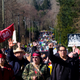 Tseil Waututh Chief Reuben George (second from right) raises a fist while leading a protest against Kinder Morgan’s Trans Mountain Pipeline expansion.